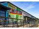 Exterior facade of building featuring signage, colorful murals, and outdoor ramp at 1450 Oglethorpe Sw Ave, Atlanta, GA 30310