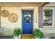 Close up of a charming blue front door with decorative wreath and potted plants at 1450 Oglethorpe Sw Ave, Atlanta, GA 30310