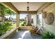 Inviting front porch with brick columns and relaxing seating area at 1450 Oglethorpe Sw Ave, Atlanta, GA 30310
