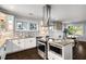 Kitchen showcases stainless appliances, granite counters, and open layout to dining and living areas at 1450 Oglethorpe Sw Ave, Atlanta, GA 30310