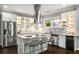 This kitchen has stainless steel appliances, granite countertops, wine cooler and island with barstool seating at 1450 Oglethorpe Sw Ave, Atlanta, GA 30310