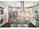 Modern kitchen boasts stainless steel appliances, granite countertops, and a stylish tile backsplash at 1450 Oglethorpe Sw Ave, Atlanta, GA 30310