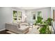 Bright living room with neutral decor, large windows, and comfortable seating at 1450 Oglethorpe Sw Ave, Atlanta, GA 30310