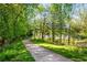 A winding path through a lush green park lined with trees and grass at 1450 Oglethorpe Sw Ave, Atlanta, GA 30310