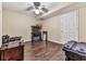 Finished bedroom with dark hardwood floors, fan and ample storage at 2311 October Nw Ct, Acworth, GA 30102