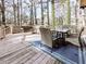 Inviting deck space features a dining table with seating and a comfortable lounge area for outdoor enjoyment at 2311 October Nw Ct, Acworth, GA 30102