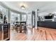 This bright dining area features hardwood floors, a wine cooler, and a table set next to large windows at 2311 October Nw Ct, Acworth, GA 30102