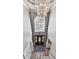 Bright foyer with chandelier and a large window above the door to allow for natural light at 2311 October Nw Ct, Acworth, GA 30102