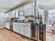 Modern kitchen with white cabinets, stainless steel appliances, and a wine refrigerator at 2311 October Nw Ct, Acworth, GA 30102