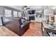 Spacious living room with hardwood floors, fireplace, built-in shelving, and abundant natural light at 2311 October Nw Ct, Acworth, GA 30102