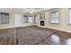 Bright living room with dark wood flooring, a fireplace, and natural light from the many windows at 2311 October Nw Ct, Acworth, GA 30102