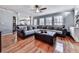 An open living room with hardwood floors, recessed lights, built in shelving and lots of windows at 2311 October Nw Ct, Acworth, GA 30102