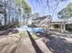 Inviting pool area adjacent to house and wood structure at 2311 October Nw Ct, Acworth, GA 30102