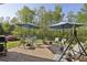 Outdoor patio features a grill, a seating area and offers views of the green backyard at 5035 Castlegate Ct, Cumming, GA 30040