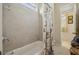 Bright bathroom with a tiled shower/tub combo and nautical themed curtain at 5035 Castlegate Ct, Cumming, GA 30040