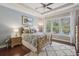 Main bedroom features natural light, tray ceiling, warm wood tones, and plush carpeting at 5035 Castlegate Ct, Cumming, GA 30040