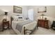 Comfortable bedroom featuring a queen bed, neutral colors, and abundant natural light at 5035 Castlegate Ct, Cumming, GA 30040