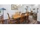 Spacious dining area with a hardwood floor, wooden table and natural lighting at 5035 Castlegate Ct, Cumming, GA 30040