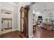 Spacious hallway showing laundry area, hardwood floors and entrance to living room at 5035 Castlegate Ct, Cumming, GA 30040