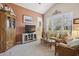 Inviting living room featuring a large window, and decoratively appointed furniture at 5035 Castlegate Ct, Cumming, GA 30040