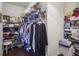 Walk-in closet with shelves, hanging clothes and hardwood floors at 5035 Castlegate Ct, Cumming, GA 30040