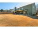 The backyard featuring a covered patio and a large, grassy lawn for outdoor activities at 5390 Chestnut Dr, Cumming, GA 30040
