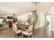 An open floor plan showcases hardwood floors, living room fireplace, and stairs to upper level at 5390 Chestnut Dr, Cumming, GA 30040