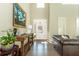Bright and airy foyer with hardwood floors, soaring ceilings, and elegant decor at 5390 Chestnut Dr, Cumming, GA 30040