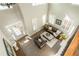 Bright, airy living room with tall windows, hardwood floors, and sophisticated furniture at 5390 Chestnut Dr, Cumming, GA 30040