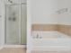 Bright bathroom with a shower and bathtub at 1519 Dolcetto Nw Trce # 1, Kennesaw, GA 30152