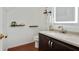 Cozy bathroom offers a granite vanity and shelves for storage at 1519 Dolcetto Nw Trce # 1, Kennesaw, GA 30152