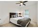 Comfortable bedroom featuring neutral colors, a ceiling fan, and natural light from the window at 1519 Dolcetto Nw Trce # 1, Kennesaw, GA 30152
