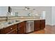 Bright kitchen featuring granite countertops, stainless steel appliances, and a convenient breakfast bar with pendant lighting at 1519 Dolcetto Nw Trce # 1, Kennesaw, GA 30152