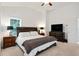 Bright main bedroom boasts a ceiling fan and furnishings at 1519 Dolcetto Nw Trce # 1, Kennesaw, GA 30152