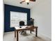 Office space with desk, chair, and dark accent wall at 1519 Dolcetto Nw Trce # 1, Kennesaw, GA 30152