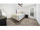 Neutral bedroom with carpet, ceiling fan and natural light from the windows at 2693 Greentree Se Dr, Marietta, GA 30067