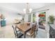Bright dining room with modern lighting and access to the outdoor patio at 2693 Greentree Se Dr, Marietta, GA 30067