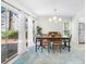 Inviting dining room with sleek lighting fixture and a view of the backyard at 2693 Greentree Se Dr, Marietta, GA 30067