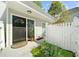 Inviting entrance with well kept flower bed, door mat, and exterior light at 2693 Greentree Se Dr, Marietta, GA 30067