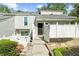 Charming townhome featuring a landscaped front yard and a cozy, enclosed entrance at 2693 Greentree Se Dr, Marietta, GA 30067