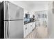 Well-lit kitchen with stainless steel appliances and a sliding glass door at 2693 Greentree Se Dr, Marietta, GA 30067