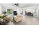Open living room with new floors, large window, ceiling fan, and adjacent dining area at 2693 Greentree Se Dr, Marietta, GA 30067