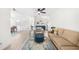 Spacious living room with hardwood floors, updated furniture, and a ceiling fan at 2693 Greentree Se Dr, Marietta, GA 30067