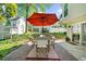Relaxing patio features an outdoor dining area with an umbrella and brickwork, perfect for entertaining and enjoying outdoor living at 2693 Greentree Se Dr, Marietta, GA 30067