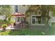 Cozy brick patio with outdoor dining area and lush greenery creating a private and serene backyard space for relaxation at 2693 Greentree Se Dr, Marietta, GA 30067