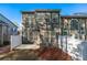 An inviting back exterior featuring ample windows and a well-maintained fenced-in yard and patio at 2732 Pierce Brennen Ct, Lawrenceville, GA 30043