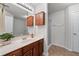 Well-lit bathroom with dual vanity, framed mirror, and walk-in shower offering modern convenience and style at 2732 Pierce Brennen Ct, Lawrenceville, GA 30043