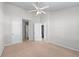 Spacious bedroom with neutral carpet, multiple doors, and natural lighting at 2732 Pierce Brennen Ct, Lawrenceville, GA 30043