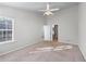 Bedroom with neutral carpet providing access to a closet and bathroom, enhancing functionality and style at 2732 Pierce Brennen Ct, Lawrenceville, GA 30043