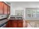 Bright dining area with hardwood floors, stylish lighting, and a view of the backyard at 2732 Pierce Brennen Ct, Lawrenceville, GA 30043